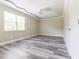 The bedroom features hardwood floors, neutral walls, a modern ceiling, and a window with natural light at 4856 Habersham Sw Rdg, Lilburn, GA 30047