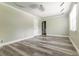 The bedroom features hardwood floors, neutral walls, a modern ceiling, and a window with natural light at 4856 Habersham Sw Rdg, Lilburn, GA 30047