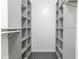 Walk-in closet offers ample storage with custom shelving and organization system at 4856 Habersham Sw Rdg, Lilburn, GA 30047