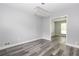 Dining room featuring modern flooring, contemporary lighting, and an open doorway to the living area at 4856 Habersham Sw Rdg, Lilburn, GA 30047