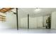 This garage features painted floors, storage, and access doors to the rest of the home and exterior at 4856 Habersham Sw Rdg, Lilburn, GA 30047