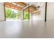 Spacious garage features an open door, painted floor, high ceilings, shelving, and storage space at 4856 Habersham Sw Rdg, Lilburn, GA 30047