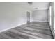 Bright living room with recessed lights, modern floors, and large windows providing natural light at 4856 Habersham Sw Rdg, Lilburn, GA 30047
