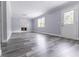 Bright living room features elegant flooring, fireplace and a door to the backyard at 4856 Habersham Sw Rdg, Lilburn, GA 30047