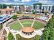 Aerial view of the amphitheater near surrounding condos and buildings at 5195 Oaks Landing Ct, Sugar Hill, GA 30518
