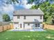 A serene backyard offers a well-maintained lawn, patio, and fenced yard at 5195 Oaks Landing Ct, Sugar Hill, GA 30518