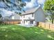 Expansive backyard with lush lawn, privacy fence, and ample space at 5195 Oaks Landing Ct, Sugar Hill, GA 30518