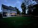 Inviting backyard with a well-maintained lawn, patio and string lights at 5195 Oaks Landing Ct, Sugar Hill, GA 30518