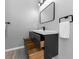 Modern bathroom vanity with open drawers, sleek fixtures, and a minimalist design at 5195 Oaks Landing Ct, Sugar Hill, GA 30518