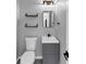 Bathroom featuring new vanity, decorative shelves, and black hardware at 5195 Oaks Landing Ct, Sugar Hill, GA 30518