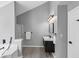 Bathroom featuring a modern vanity, soaking tub, and glass-enclosed shower at 5195 Oaks Landing Ct, Sugar Hill, GA 30518