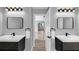 Bathroom featuring dual sinks, modern fixtures, and a view into the adjacent bedroom at 5195 Oaks Landing Ct, Sugar Hill, GA 30518