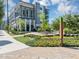 Beautiful condo building featuring well manicured landscaping and manicured lawns at 5195 Oaks Landing Ct, Sugar Hill, GA 30518