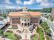 An aerial of the City of Sugar Hill building with a copper roof, and a public garden at 5195 Oaks Landing Ct, Sugar Hill, GA 30518
