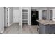 Kitchen with island and view of pantry and appliances at 5195 Oaks Landing Ct, Sugar Hill, GA 30518