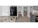 Open kitchen concept with stainless steel refrigerator and kitchen island at 5195 Oaks Landing Ct, Sugar Hill, GA 30518