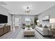 Cozy living room featuring stylish furniture, neutral colors, and ample natural light at 5195 Oaks Landing Ct, Sugar Hill, GA 30518