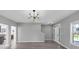 Bright, airy living room featuring an open floor plan and contemporary lighting at 5195 Oaks Landing Ct, Sugar Hill, GA 30518