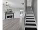 Living area with fireplace and stairway at 5195 Oaks Landing Ct, Sugar Hill, GA 30518
