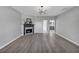 Spacious open-concept living room featuring a fireplace and stylish decor at 5195 Oaks Landing Ct, Sugar Hill, GA 30518
