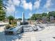 Beautiful veteran's memorial with a waterfall and blue skies at 5195 Oaks Landing Ct, Sugar Hill, GA 30518
