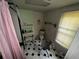 The bathroom features a bathtub, a toilet, and a sink at 6733 Old Covington Rd, Lithonia, GA 30058
