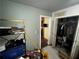 This bedroom features a closet and shelving unit for storage at 6733 Old Covington Rd, Lithonia, GA 30058
