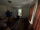 This bedroom features a window, a closet, and old floors at 6733 Old Covington Rd, Lithonia, GA 30058