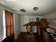 A bedroom interior shows possible ceiling damage and weathered flooring, needing remodeling and renovation at 6733 Old Covington Rd, Lithonia, GA 30058