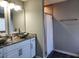 Modern bathroom featuring double sinks, a granite countertop, and a separate shower at 842 Shoals Ct, Atlanta, GA 30349