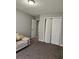 Comfortable bedroom with a walk-in closet and ample natural light at 842 Shoals Ct, Atlanta, GA 30349