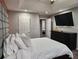 This bedroom is spacious and bright with a dark dresser and wall-mounted TV at 842 Shoals Ct, Atlanta, GA 30349