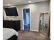 Bedroom with a TV, mirror, dresser and doorway to the bathroom at 842 Shoals Ct, Atlanta, GA 30349