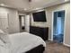 Spacious bedroom featuring a TV, doorways to a bedroom and a bathroom at 842 Shoals Ct, Atlanta, GA 30349