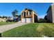 Inviting two-story home with a spacious driveway and well-maintained lawn at 842 Shoals Ct, Atlanta, GA 30349