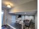 Open-concept living room boasts a fireplace, modern lighting, and wood-look flooring at 842 Shoals Ct, Atlanta, GA 30349