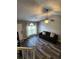 Comfortable living room with hardwood floors, ceiling fan, and natural light at 842 Shoals Ct, Atlanta, GA 30349
