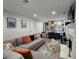 Relax in this living room with a fireplace and views of the kitchen and dining area at 842 Shoals Ct, Atlanta, GA 30349