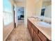 Bathroom boasts a double sink vanity, with neutral finishes, and toilet located inside private room at 171 Shaker Hollow Drive Dr, Mcdonough, GA 30253