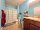 Bathroom featuring a shower with a curtain, single sink, and blue walls at 171 Shaker Hollow Drive Dr, Mcdonough, GA 30253
