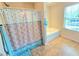 Well-lit bathroom with a separate shower and soaking tub, and natural light at 171 Shaker Hollow Drive Dr, Mcdonough, GA 30253
