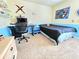 Cozy bedroom with a desk and shelves for storage and decor at 171 Shaker Hollow Drive Dr, Mcdonough, GA 30253