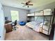 Functional bedroom featuring a bunk bed, study desk, and plenty of space for relaxation and play at 171 Shaker Hollow Drive Dr, Mcdonough, GA 30253
