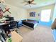 Bright bedroom with a desk and blue accent wall, a comfortable bed, and ample desk space at 171 Shaker Hollow Drive Dr, Mcdonough, GA 30253