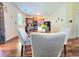 Cozy dining area with kitchen view features modern decor and hardwood flooring at 171 Shaker Hollow Drive Dr, Mcdonough, GA 30253