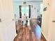 Dining area featuring wood floors, modern lighting, and a door to the backyard at 171 Shaker Hollow Drive Dr, Mcdonough, GA 30253