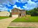 Charming two-story brick home with a well-manicured lawn and a two-car garage at 171 Shaker Hollow Drive Dr, Mcdonough, GA 30253