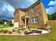 Charming two-story home with brick and siding exterior and a well-maintained landscaped front yard at 171 Shaker Hollow Drive Dr, Mcdonough, GA 30253