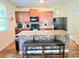 Kitchen featuring laminate floors, wooden cabinets, granite countertop, and black appliances at 171 Shaker Hollow Drive Dr, Mcdonough, GA 30253