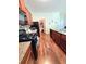 Kitchen with granite counters, wooden cabinets, black appliances, and laminate flooring at 171 Shaker Hollow Drive Dr, Mcdonough, GA 30253